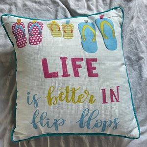 A quote pillow with blue on the back
